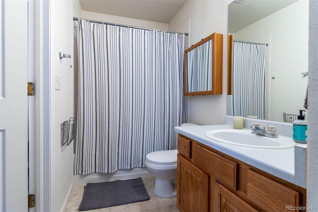 bathroom featuring walk in shower, vanity, toilet, and tile patterned floors