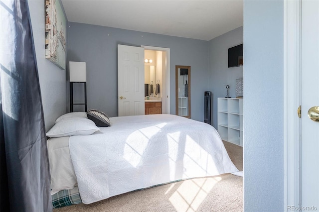 bedroom with carpet flooring and ensuite bathroom