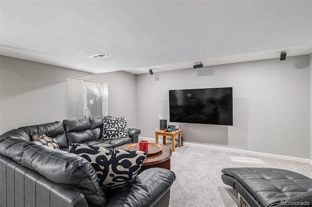 living room featuring carpet floors and a textured ceiling