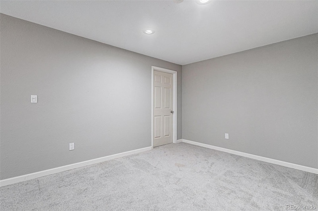 empty room featuring light colored carpet