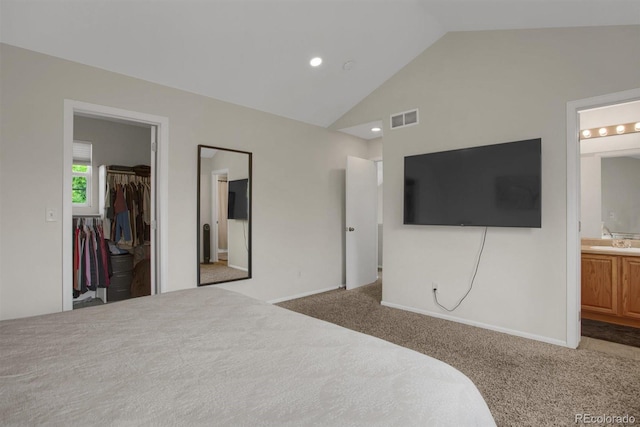 6260 E 114th Ave, Thornton, CO 80233 - bedroom with a walk in closet, carpet floors, ensuite bathroom, a closet, and high vaulted ceiling