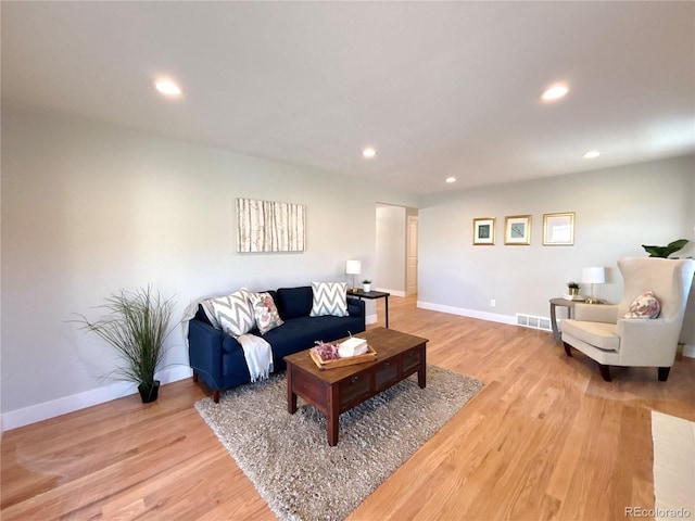 living room with light hardwood / wood-style floors