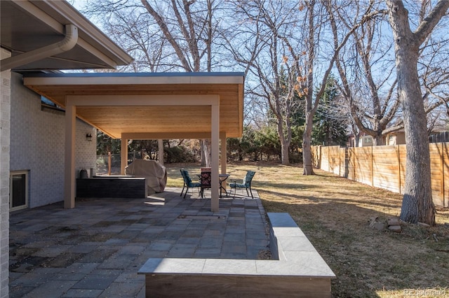 view of patio / terrace featuring outdoor dining area and fence