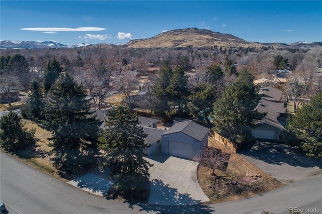 birds eye view of property with a mountain view