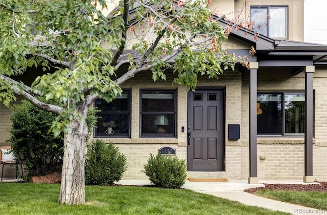 1272 S Milwaukee St, Denver, CO 80210 - view of exterior entry with brick siding