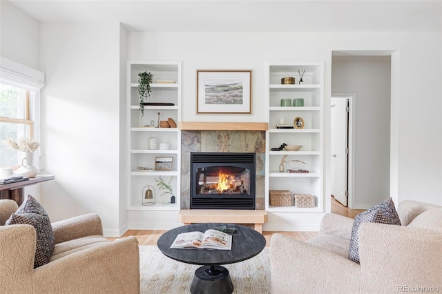 1272 S Milwaukee St, Denver, CO 80210 - living room with a tiled fireplace and wood finished floors