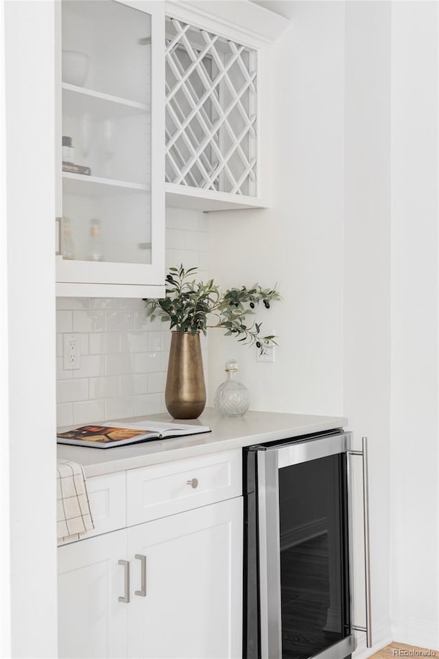 1272 S Milwaukee St, Denver, CO 80210 - indoor dry bar featuring wine cooler and tasteful backsplash