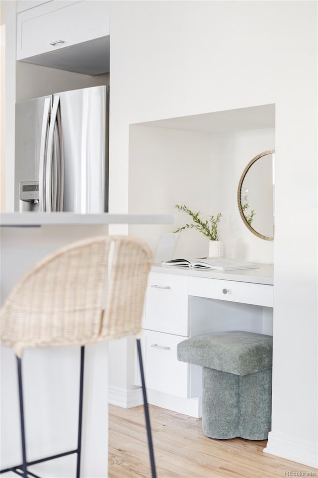 1272 S Milwaukee St, Denver, CO 80210 - detailed view of freestanding refrigerator and wood finished floors