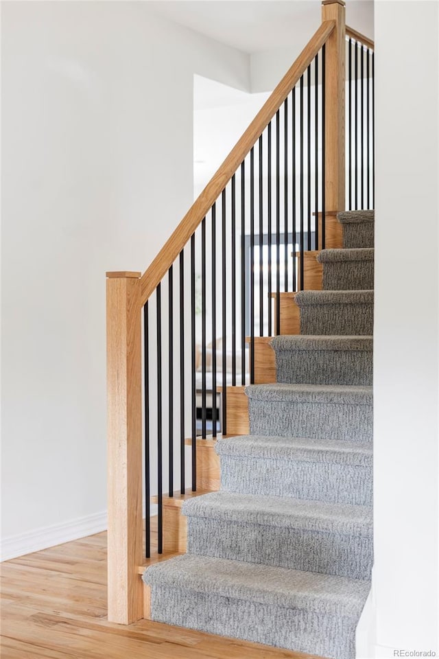 1272 S Milwaukee St, Denver, CO 80210 - staircase with wood finished floors and baseboards