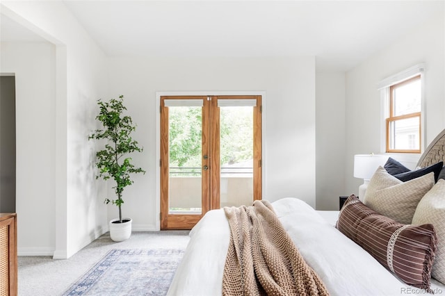 1272 S Milwaukee St, Denver, CO 80210 - bedroom with access to exterior and light colored carpet