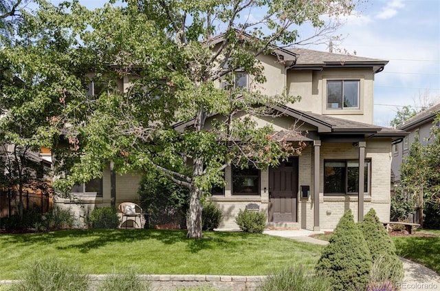 1272 S Milwaukee St, Denver, CO 80210 - view of front facade featuring a front yard, brick siding, a shingled roof, and stucco siding