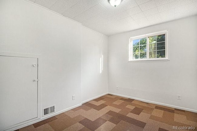 view of carpeted spare room