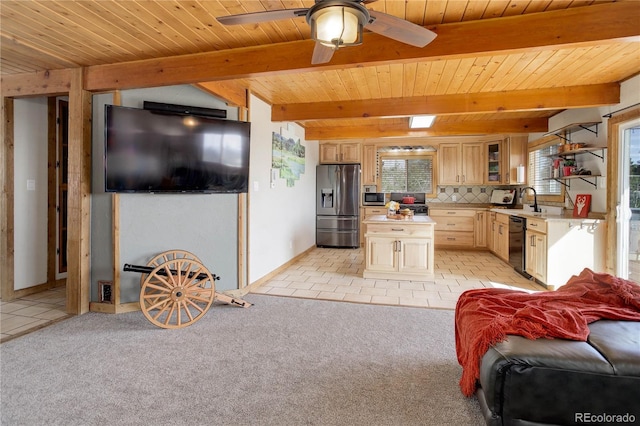 952 Burland Dr, Bailey, CO 80421 - kitchen featuring stainless steel appliances, light countertops, light brown cabinetry, wood ceiling with exposed beams, and glass insert cabinets