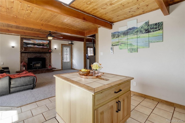952 Burland Dr, Bailey, CO 80421 - kitchen featuring tile countertops, light tile patterned flooring, wooden ceiling with exposed beams, ceiling fan, and baseboards