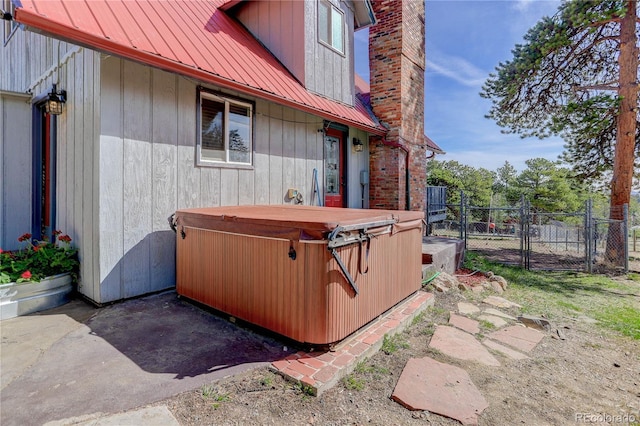 952 Burland Dr, Bailey, CO 80421 - view of patio with a hot tub and a gate