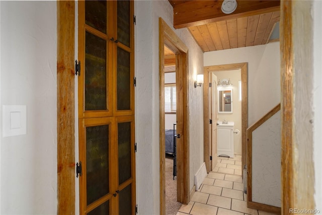 952 Burland Dr, Bailey, CO 80421 - hallway featuring light tile patterned flooring, a sink, and wooden ceiling
