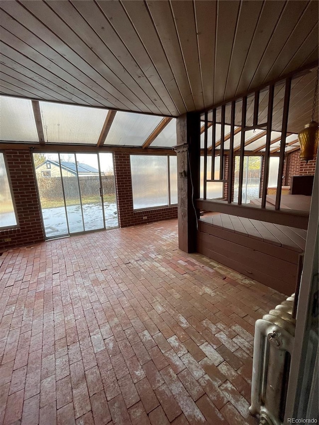 unfurnished sunroom with radiator