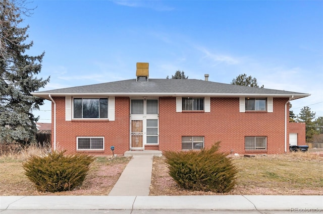 4731 W 66th Ave, Arvada, CO 80003 - split foyer home with brick siding and roof with shingles