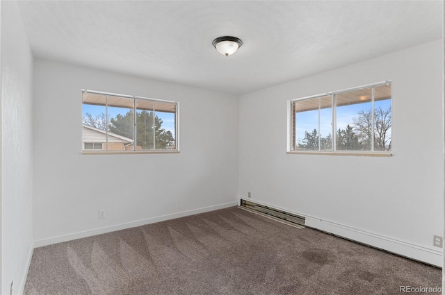 4731 W 66th Ave, Arvada, CO 80003 - empty room featuring a baseboard heating unit, plenty of natural light, carpet floors, and baseboards