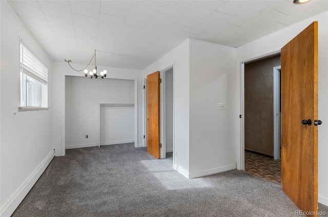 4731 W 66th Ave, Arvada, CO 80003 - spare room featuring carpet, a chandelier, and baseboards