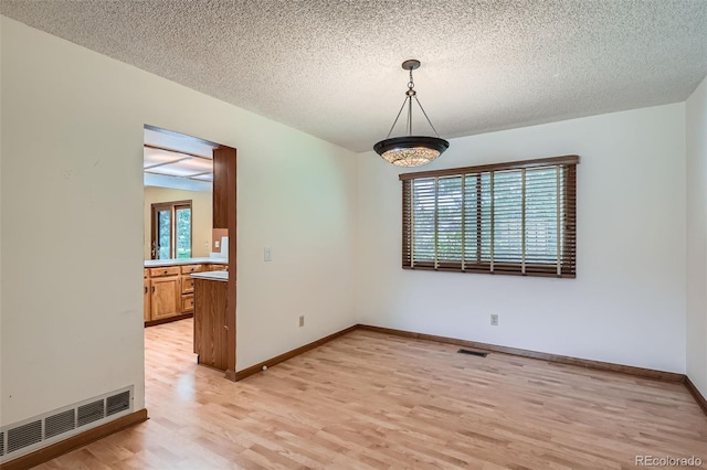 20596 E Shefield Ct, Parker, CO 80138 - unfurnished room featuring light wood finished floors and a textured ceiling