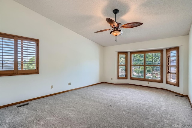 20596 E Shefield Ct, Parker, CO 80138 - carpeted spare room with a textured ceiling, lofted ceiling, and a ceiling fan