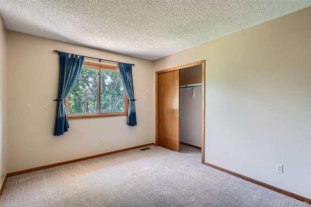 20596 E Shefield Ct, Parker, CO 80138 - unfurnished bedroom with carpet flooring, a textured ceiling, and a closet