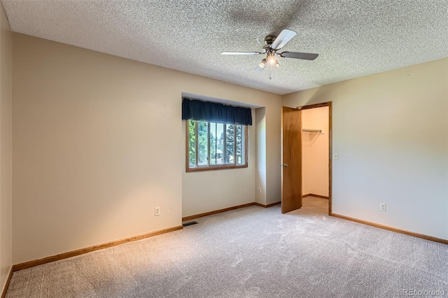 20596 E Shefield Ct, Parker, CO 80138 - unfurnished bedroom featuring carpet flooring, a textured ceiling, ceiling fan, and a closet
