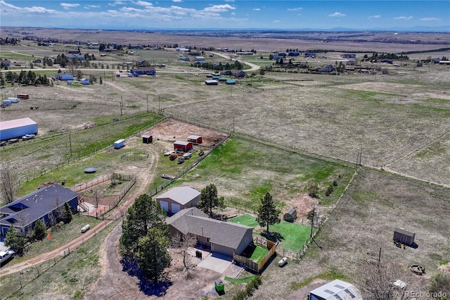 birds eye view of property featuring a rural view