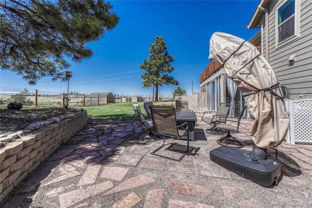 view of patio featuring fence