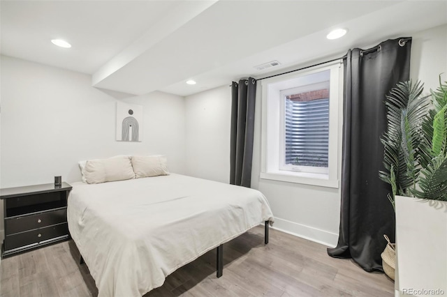 bedroom with baseboards, light wood-style flooring, and recessed lighting