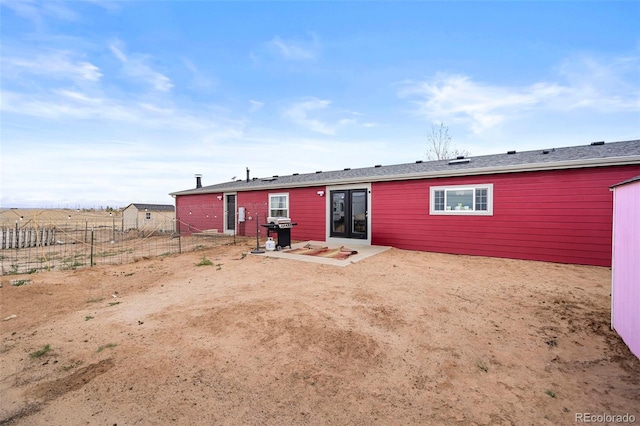 rear view of house featuring a patio