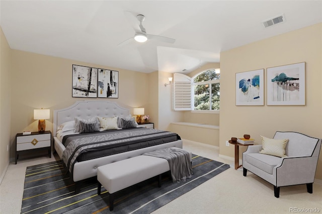 carpeted bedroom featuring baseboards, ceiling fan, and visible vents