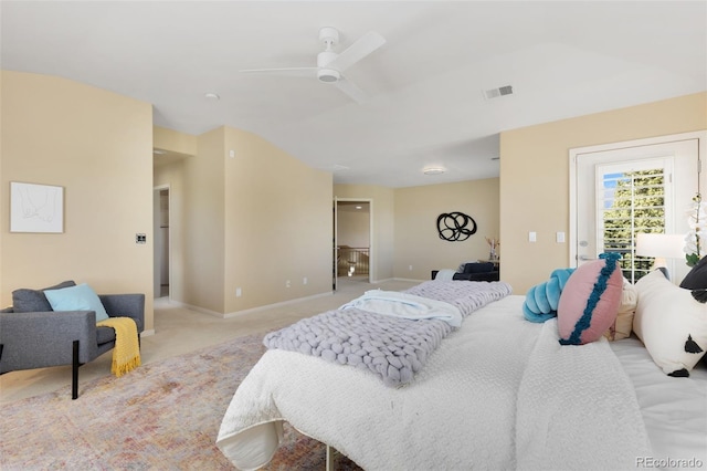 bedroom with baseboards, a ceiling fan, visible vents, and light colored carpet