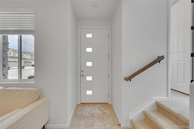 4612 S Wenatchee St Unit A, Aurora, CO 80015 - foyer entrance with baseboards and light colored carpet