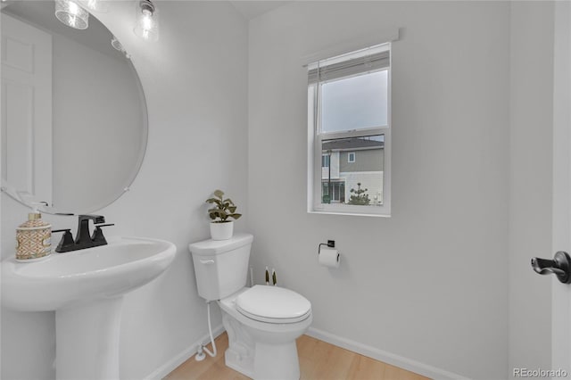 4612 S Wenatchee St Unit A, Aurora, CO 80015 - half bath with baseboards and wood finished floors