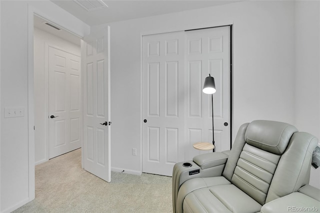 4612 S Wenatchee St Unit A, Aurora, CO 80015 - living area featuring light colored carpet and baseboards
