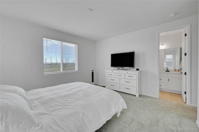 4612 S Wenatchee St Unit A, Aurora, CO 80015 - bedroom featuring light colored carpet, multiple windows, and ensuite bath