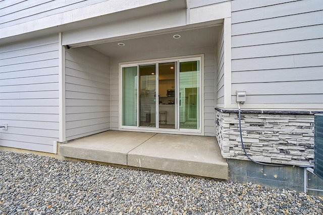 4612 S Wenatchee St Unit A, Aurora, CO 80015 - view of exterior entry featuring a patio