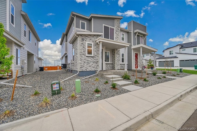 4612 S Wenatchee St Unit A, Aurora, CO 80015 - modern home featuring stone siding and a residential view