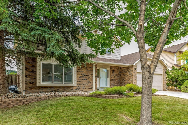 6005 S Vivian St, Littleton, CO 80127 - obstructed view of property featuring brick siding, an attached garage, concrete driveway, a front yard, and a shingled roof
