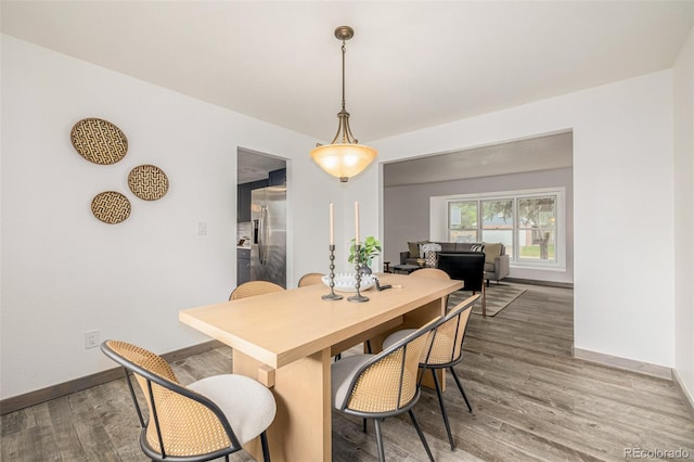 6005 S Vivian St, Littleton, CO 80127 - dining space featuring baseboards and wood finished floors