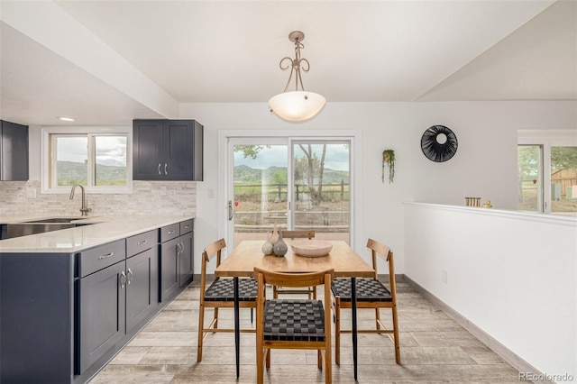 6005 S Vivian St, Littleton, CO 80127 - dining area with light wood-style flooring and baseboards