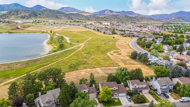 6005 S Vivian St, Littleton, CO 80127 - aerial perspective of suburban area featuring a water and mountain view