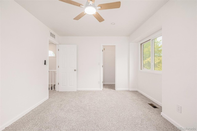 6005 S Vivian St, Littleton, CO 80127 - unfurnished bedroom featuring carpet, a walk in closet, and ceiling fan