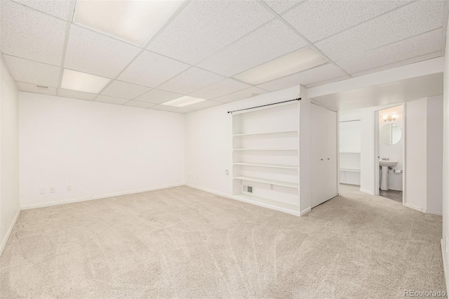 6005 S Vivian St, Littleton, CO 80127 - basement with a paneled ceiling, carpet, and built in features