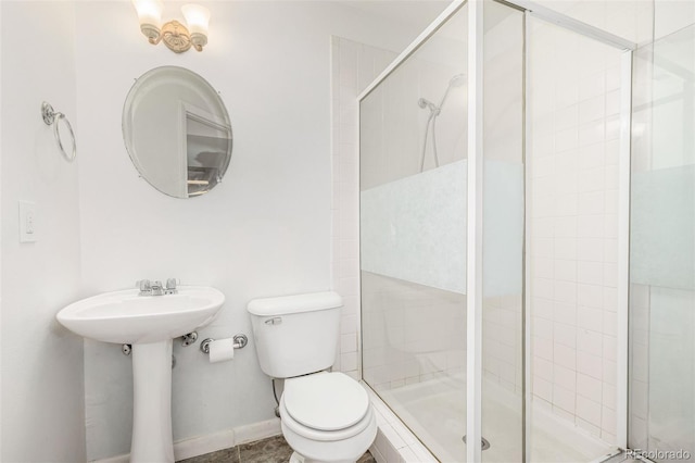6005 S Vivian St, Littleton, CO 80127 - full bathroom featuring toilet and a shower stall