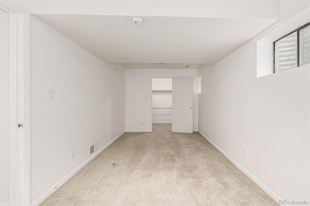 6005 S Vivian St, Littleton, CO 80127 - empty room featuring light carpet and a smoke detector