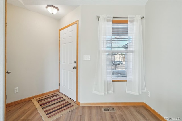 foyer with light hardwood / wood-style floors