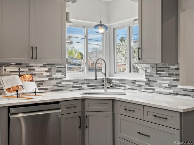 2535 Leyden St, Denver, CO 80207 - kitchen featuring stainless steel dishwasher, gray cabinets, a sink, and tasteful backsplash